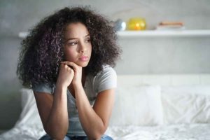 woman looking to the side experiencing withdrawal symptoms