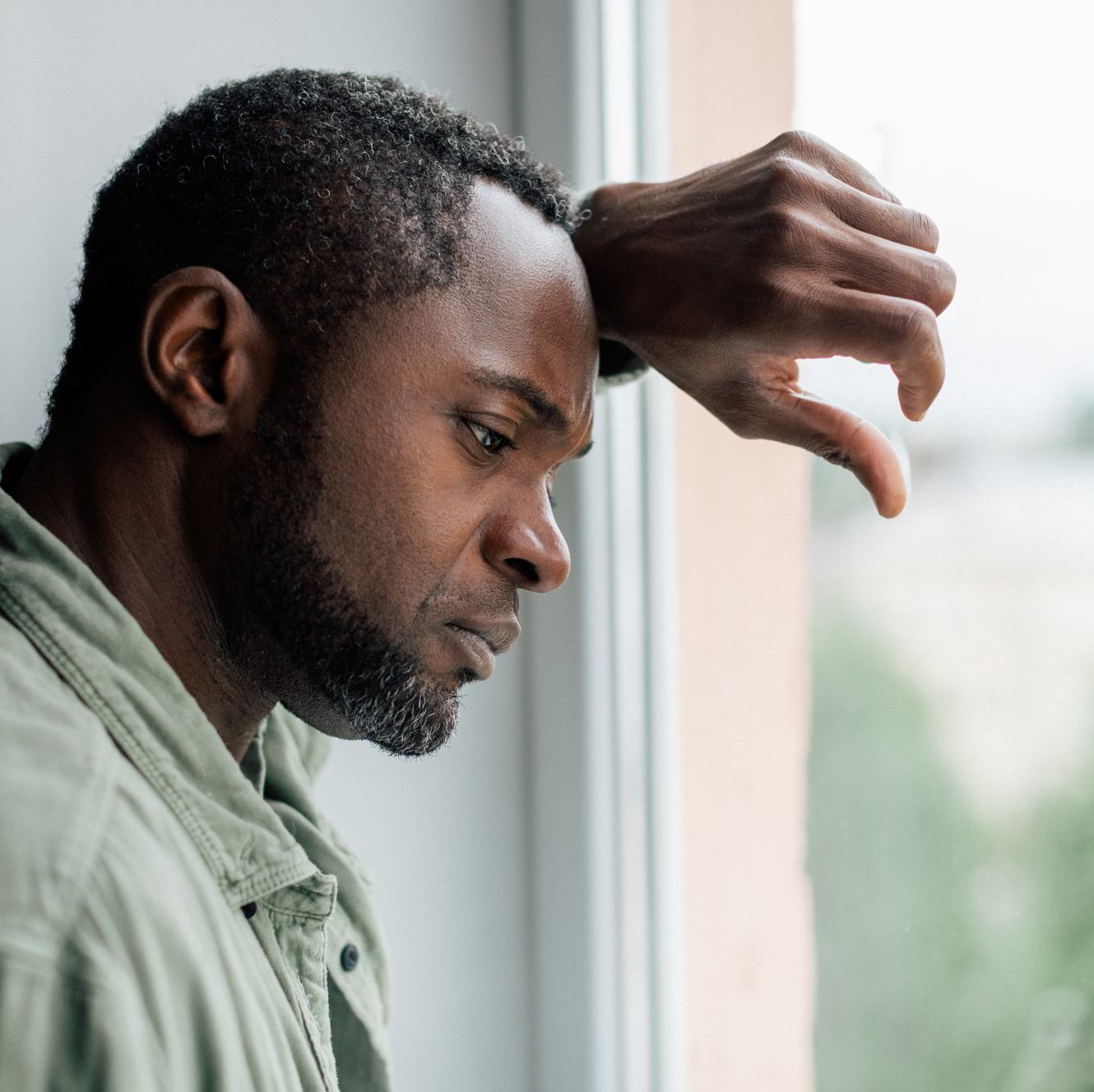 Man looking outside a window