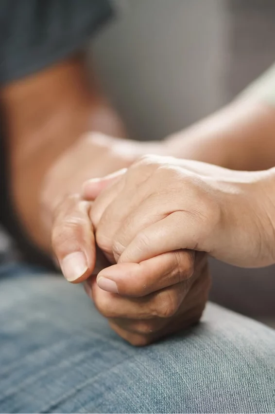 Hand being held