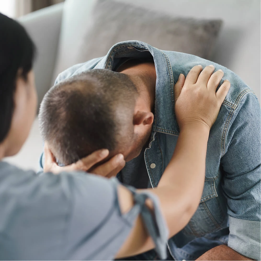 Person comforting another