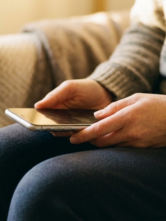 hands holding a phone, a quiet moment before starting treatment